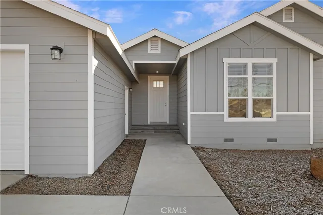 a view of a house with a door and a window