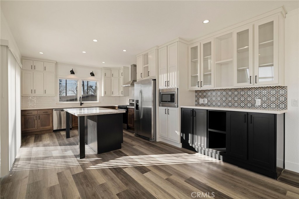 926 Bille Road Paradise, CA 95969 - Photo 5 of 28 a kitchen with kitchen island granite countertop a refrigerator oven a sink and cabinets