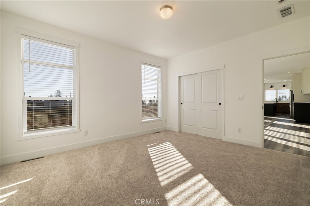 926 Bille Road Paradise, CA 95969 - Photo 10 of 28 a view of empty room with stairs and a window