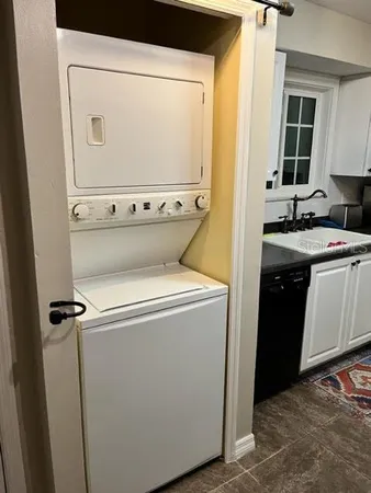 a stove top oven sitting inside of a kitchen