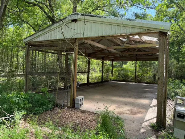 a view of a room with a big yard