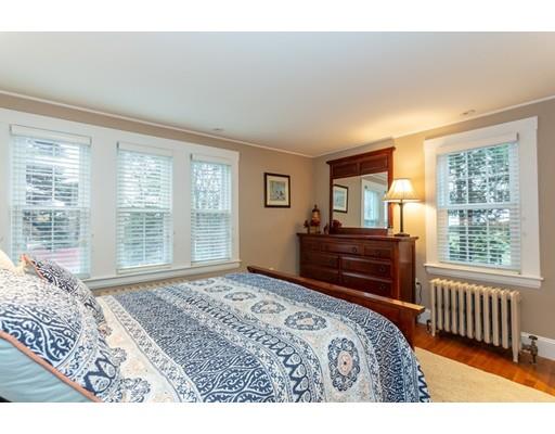 42 Gayland Road Needham, MA 02492 - Photo 11 of 22 a bedroom with a bed and wooden floor