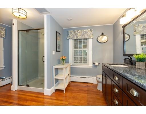 42 Gayland Road Needham, MA 02492 - Photo 13 of 22 a spacious bathroom with a granite countertop sink a mirror and shower