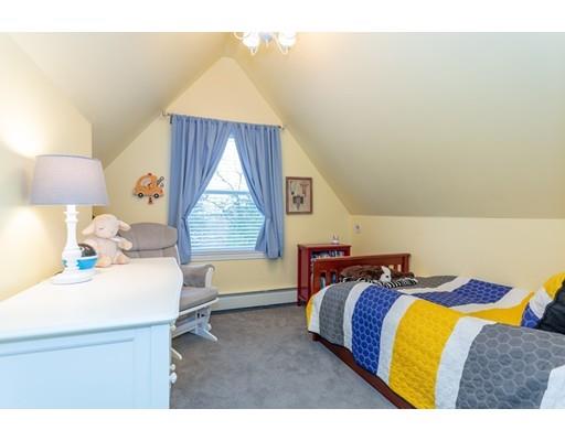 42 Gayland Road Needham, MA 02492 - Photo 16 of 22 a bedroom with a bed and a window