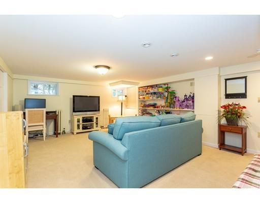 42 Gayland Road Needham, MA 02492 - Photo 18 of 22 a living room with furniture and a flat screen tv