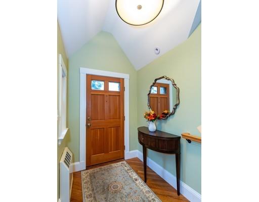 42 Gayland Road Needham, MA 02492 - Photo 2 of 22 a living room with table and a mirror