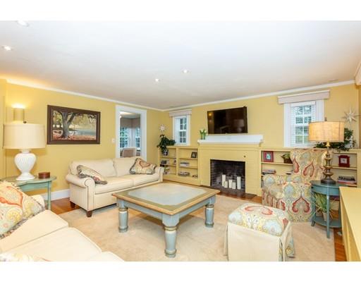 42 Gayland Road Needham, MA 02492 - Photo 3 of 22 a living room with furniture a fireplace and a flat screen tv