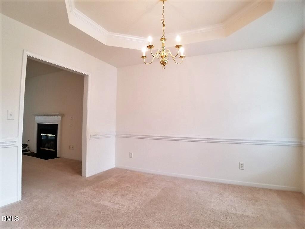 2100 Ramsgate Street Raleigh, NC 27603 - Photo 4 of 13 wooden floor in an empty room with a window