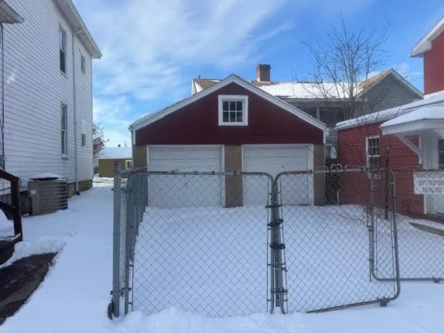 a front view of a house with parking space
