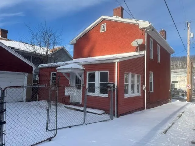 a front view of a house with a garage
