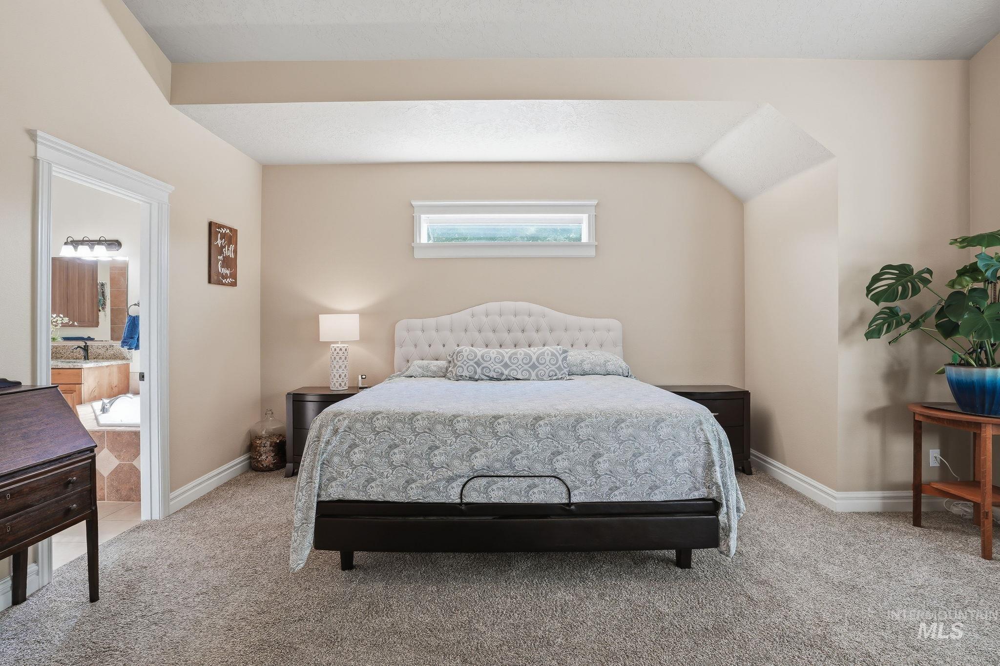 3969 North Hollymount Way Meridian, ID 83646 - Photo 22 of 47 Carpeted room featuring a high window, vaulted ceiling, and recessed lighting