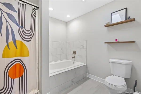 a bathroom with a sink a mirror and a toilet
