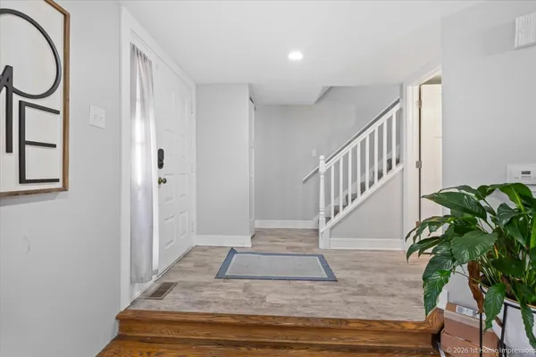 a view of entryway with wooden floor