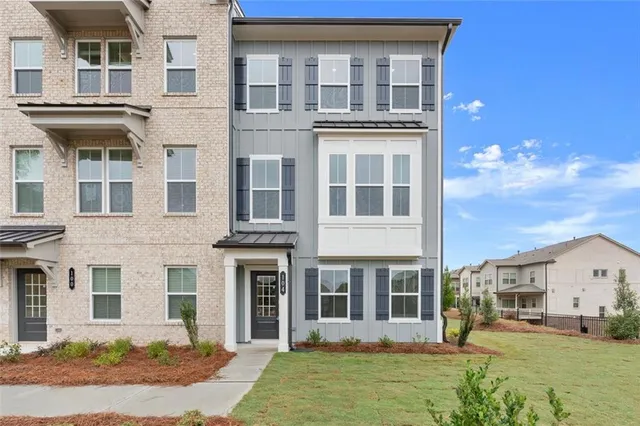 a front view of a house with a yard