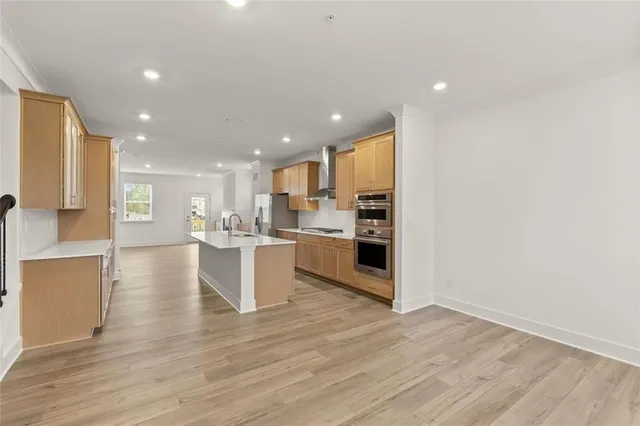a view of kitchen with wooden floor