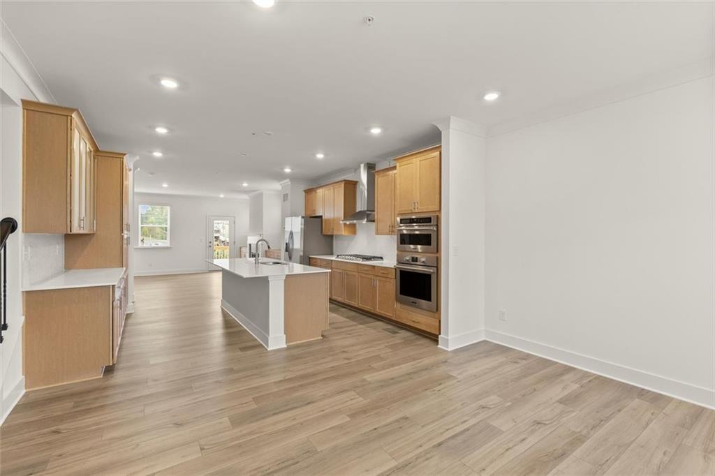 104 Agnew Way Woodstock, GA 30188 - Photo 13 of 47 a view of kitchen with wooden floor