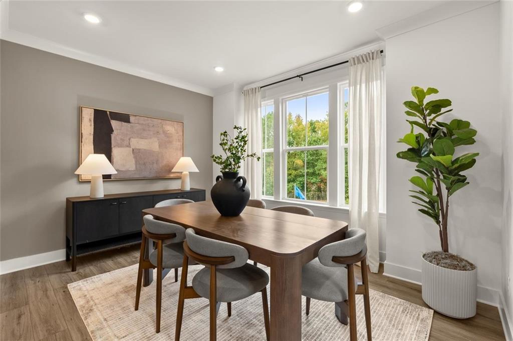104 Agnew Way Woodstock, GA 30188 - Photo 16 of 47 a view of a dining room with furniture window and wooden floor