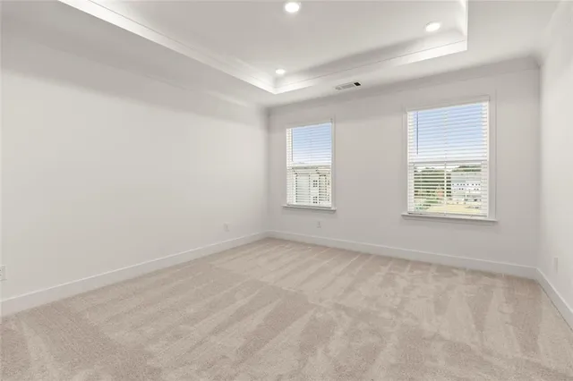 a bedroom with bed and a large window