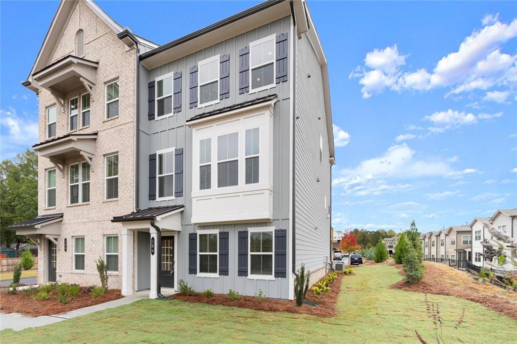 104 Agnew Way Woodstock, GA 30188 - Photo 2 of 47 a view of a house with a yard
