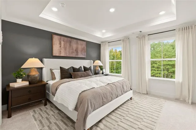a bathroom with double vanity and a shower