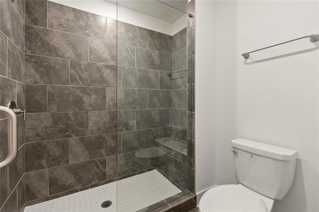 104 Agnew Way Woodstock, GA 30188 - Photo 27 of 47 a bathroom with a toilet and a shower