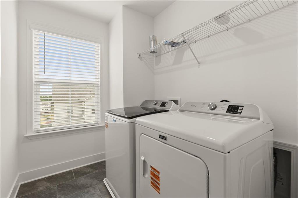 104 Agnew Way Woodstock, GA 30188 - Photo 28 of 47 a utility room with dryer and washer