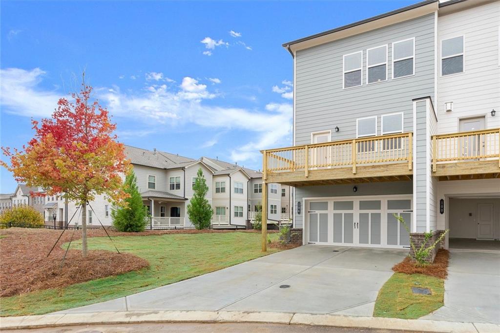 104 Agnew Way Woodstock, GA 30188 - Photo 33 of 47 a front view of a house with a yard