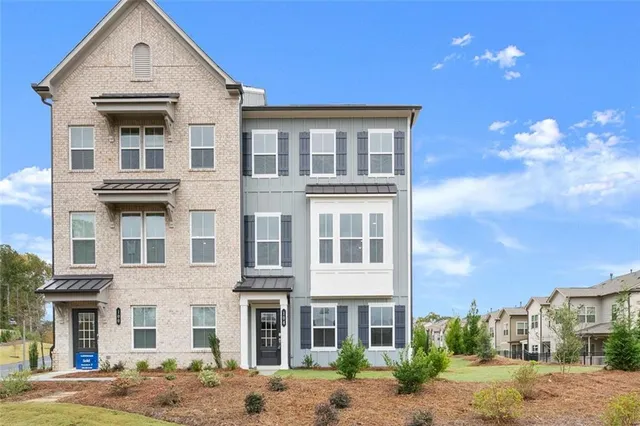 a view of a building with a yard