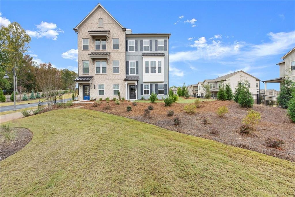 104 Agnew Way Woodstock, GA 30188 - Photo 37 of 47 a view of a building with a yard