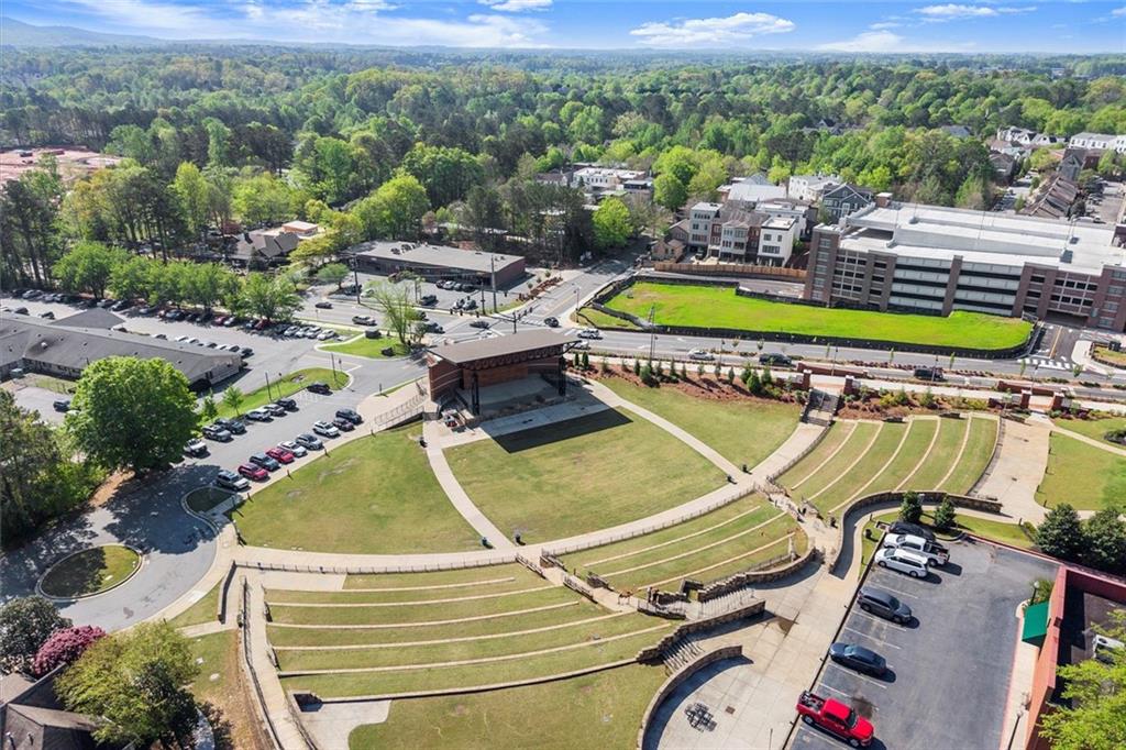 104 Agnew Way Woodstock, GA 30188 - Photo 42 of 47 a view of a swimming pool with lawn chairs and couches