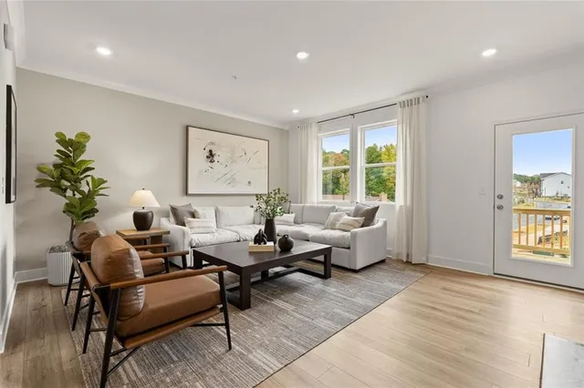 a living room with furniture and a large window