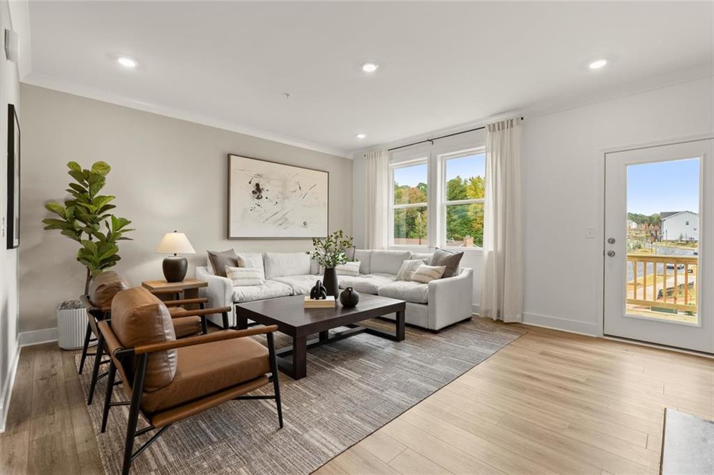 104 Agnew Way Woodstock, GA 30188 - Photo 6 of 47 a living room with furniture and a large window