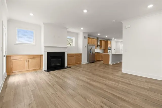 a view of a kitchen with a sink and a stove top oven
