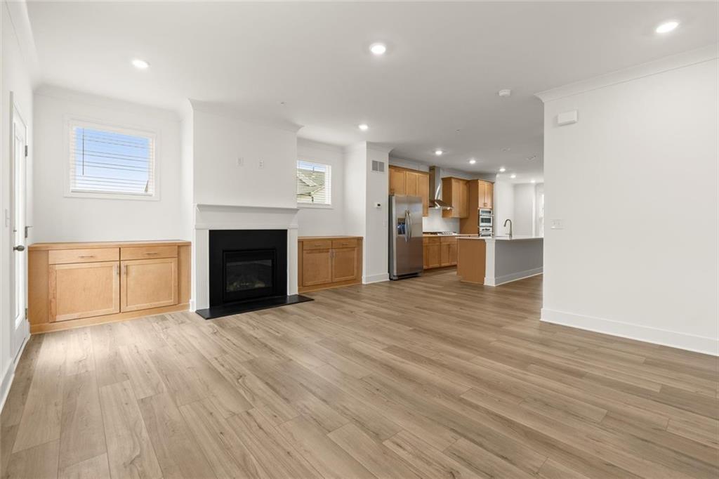 104 Agnew Way Woodstock, GA 30188 - Photo 7 of 47 a view of a kitchen with a sink and a stove top oven