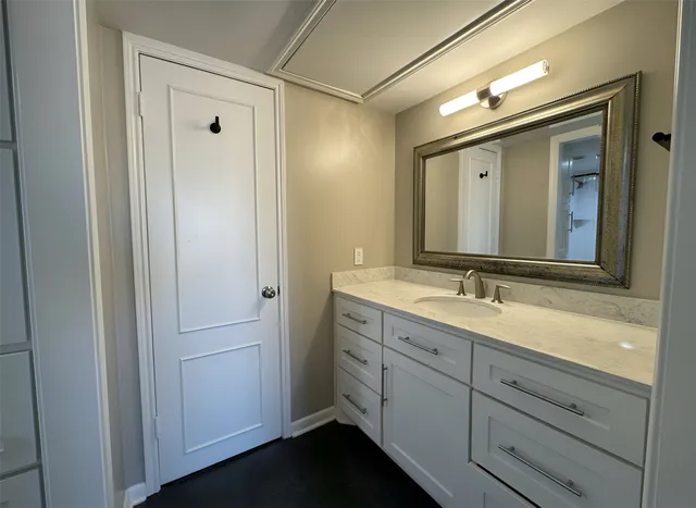 a bathroom with a double vanity sink and mirror