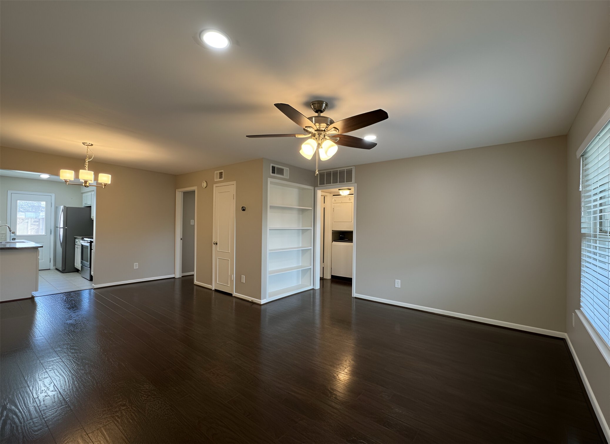 845 Augusta Drive, Unit 90 Houston, TX 77057 - Photo 3 of 17 a view of an empty room with wooden floor
