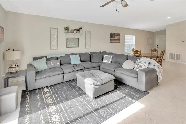 a living room with furniture and a couch