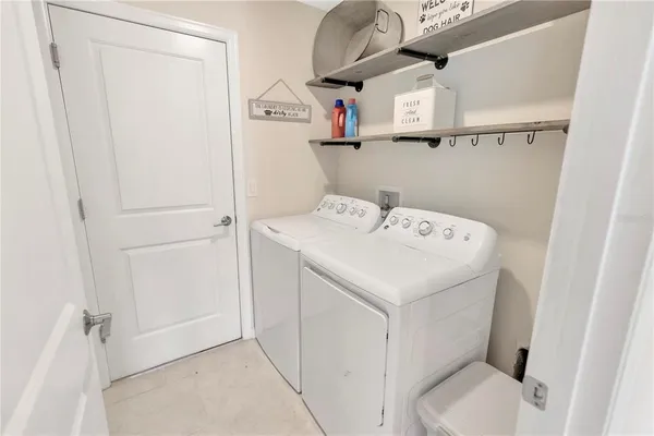 a utility room with dryer and washer