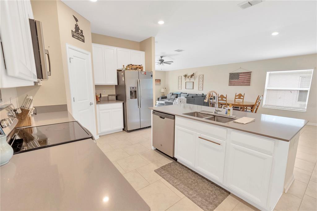 530 Patton Loop Bartow, FL 33830 - Photo 18 of 38 a kitchen with stainless steel appliances granite countertop a sink stove and refrigerator