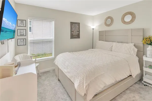 a large white bed in a white room