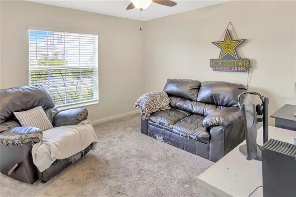 a living room with furniture and a window
