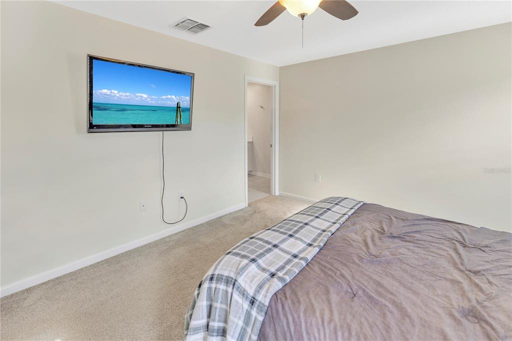 530 Patton Loop Bartow, FL 33830 - Photo 28 of 38 a bedroom with a bed and a flat screen tv