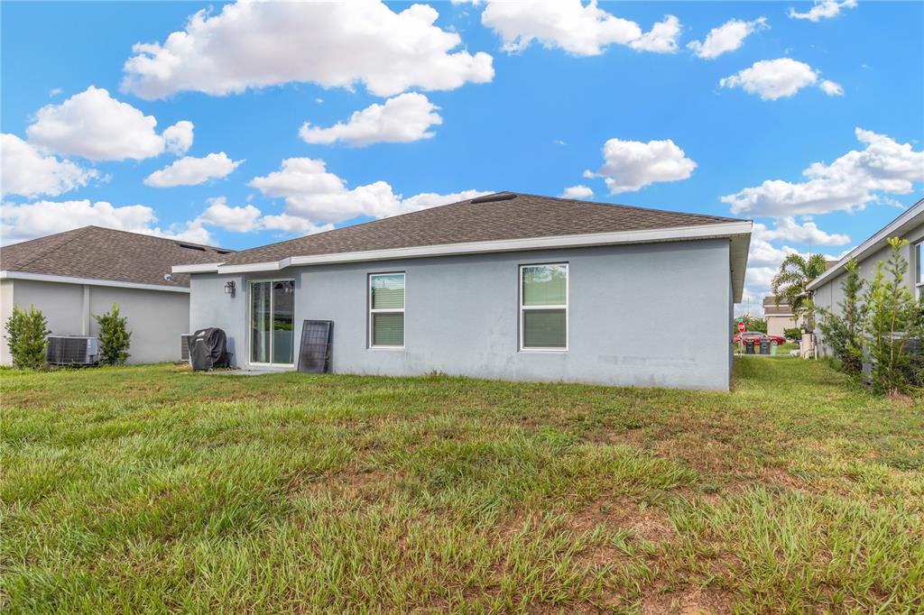 530 Patton Loop Bartow, FL 33830 - Photo 6 of 38 a front view of house with yard and trees