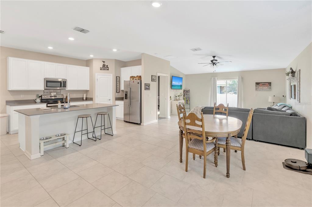 530 Patton Loop Bartow, FL 33830 - Photo 7 of 38 a dining room with furniture and a chandelier