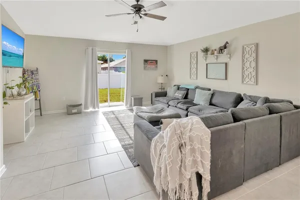 a living room with furniture and a window