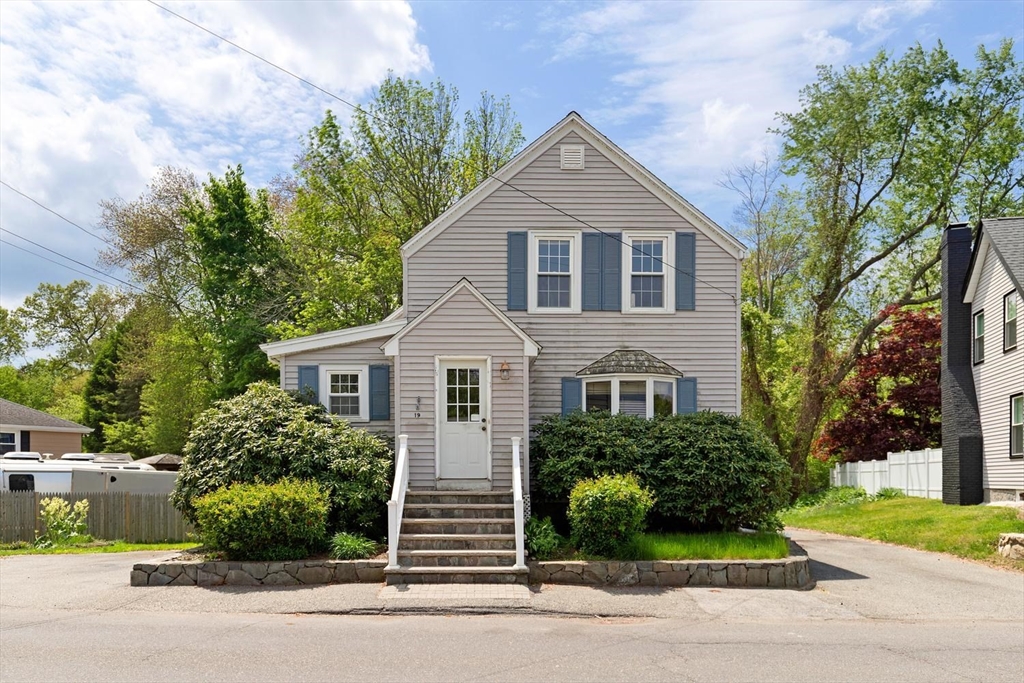 19 Butler Avenue Wakefield, MA 01880 - Photo 1 of 33 a front view of a house with a yard
