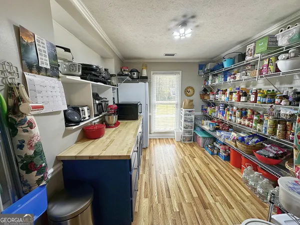 a bed room with a bed and a book shelf