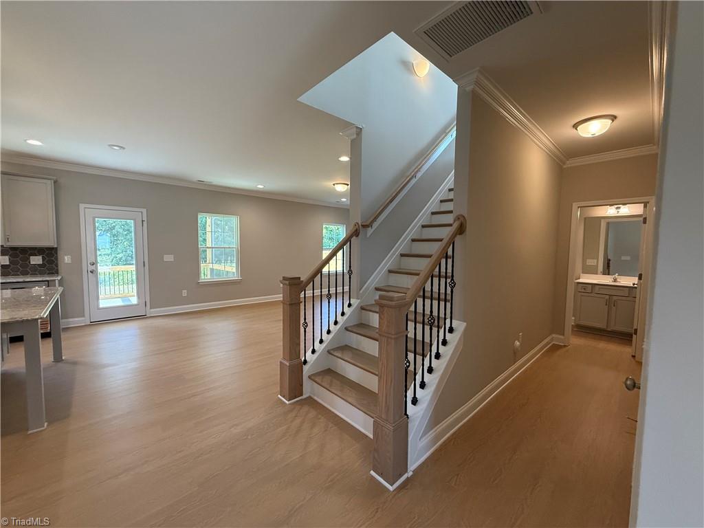 3199 Riley Ford Trail High Point, NC 27265 - Photo 14 of 33 Craftsman newel posts and iron rails