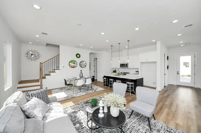 a living room with furniture and a table