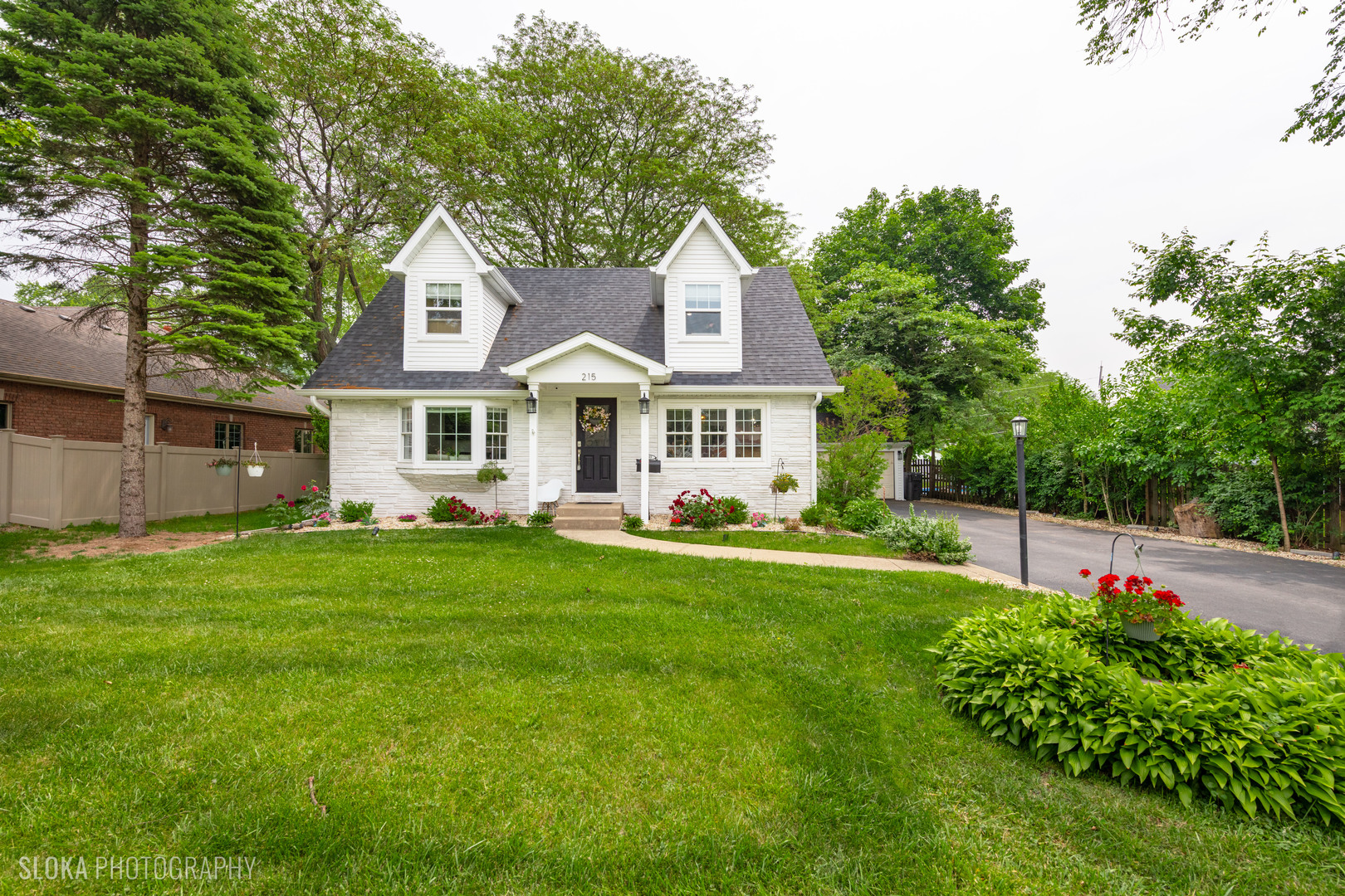 215 Rush Street Roselle, IL 60172 - Photo 1 of 1 a front view of a house with a yard